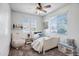 Bright bedroom with ample natural light, featuring a comfortable bed and charming decor at 11729 W Maui Ln, El Mirage, AZ 85335