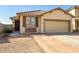 Charming single-story home featuring a well-manicured front yard and attached two-car garage at 11729 W Maui Ln, El Mirage, AZ 85335