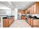 Modern kitchen featuring stainless steel appliances, granite countertops, and ample cabinet space at 11729 W Maui Ln, El Mirage, AZ 85335