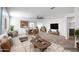 Open-concept living room with stylish furnishings, seamlessly flowing into the dining area and kitchen at 11729 W Maui Ln, El Mirage, AZ 85335