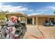 Garage view featuring an open garage, golf carts, and storage at 12032 N Hillcrest Dr, Sun City, AZ 85351