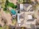 Aerial view of property showcasing the unique roofline, manicured landscaping, pool, and private backyard at 13126 E Turquoise Ave, Scottsdale, AZ 85259