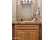 Bathroom features tan tile surround, wood vanity, and ample countertop space at 13126 E Turquoise Ave, Scottsdale, AZ 85259