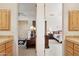 A view of two bedrooms connected by a hallway with a matching bedroom set at 13126 E Turquoise Ave, Scottsdale, AZ 85259