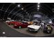 Classic cars displayed in a large auction arena ready for bidding at 13126 E Turquoise Ave, Scottsdale, AZ 85259