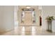 Grand foyer featuring decorative tile flooring, arched doorways, and a beautiful front door with glass panels at 13126 E Turquoise Ave, Scottsdale, AZ 85259