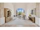 Bright living room with a large arched window overlooking the desert landscape at 13126 E Turquoise Ave, Scottsdale, AZ 85259