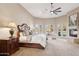 Spacious main bedroom with fireplace, ceiling fan, sitting area, and access to outdoor patio at 13126 E Turquoise Ave, Scottsdale, AZ 85259