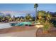 Stunning backyard pool with spa, rock waterfall, and desert landscape offers a private retreat at 13126 E Turquoise Ave, Scottsdale, AZ 85259
