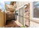 View of the front entrance featuring rock accents and a secure metal gate at 1316 N 85Th Pl, Scottsdale, AZ 85257