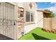 View of the front entrance with a secure door and rock features adding to the curb appeal at 1316 N 85Th Pl, Scottsdale, AZ 85257