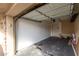 Spacious two-car garage with ample room for storage and a door to the home's interior at 1316 N 85Th Pl, Scottsdale, AZ 85257