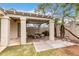 Outdoor patio area with pergola and stone table and benches, great for entertaining at 1316 N 85Th Pl, Scottsdale, AZ 85257