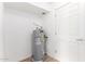 Well-maintained water heater in the utility room, ensuring reliable hot water supply at 1316 N 85Th Pl, Scottsdale, AZ 85257