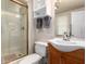 Bathroom featuring updated vanity, fixtures, and enclosed shower at 13311 W Copperstone Dr, Sun City West, AZ 85375