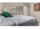 This inviting bedroom has an open door to an adjacent room, and a shuttered window at 13311 W Copperstone Dr, Sun City West, AZ 85375