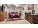 Spacious bedroom featuring ceiling fan and traditional decor at 13311 W Copperstone Dr, Sun City West, AZ 85375