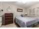 Cozy bedroom featuring neutral walls, shutters on the window, and an inviting queen-sized bed at 13311 W Copperstone Dr, Sun City West, AZ 85375