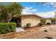Charming single-story home with lush desert landscaping featuring a well-maintained facade and walkway at 13311 W Copperstone Dr, Sun City West, AZ 85375
