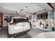 Well-organized garage with epoxy floors, ample storage, and parking for a Nissan Rogue at 13311 W Copperstone Dr, Sun City West, AZ 85375