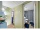 Bright bathroom featuring a patterned shower curtain, and wood-look floors at 14002 N 49Th Ave # 1094, Glendale, AZ 85306