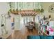 Inviting dining area with wood-look floors, built-in shelving, and view into the kitchen at 14002 N 49Th Ave # 1094, Glendale, AZ 85306