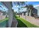 Exterior view of multi-Gathering residential building with grass, brick wall, and mature trees at 14002 N 49Th Ave # 1094, Glendale, AZ 85306