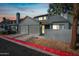 Charming two-story townhouse with a private two-car garage and well-maintained gray wood-clad exterior at 14002 N 49Th Ave # 1094, Glendale, AZ 85306