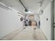 Spacious garage with overhead storage and built-in work area at 14002 N 49Th Ave # 1094, Glendale, AZ 85306
