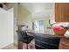 Well-appointed kitchenette featuring breakfast bar seating and views of the backyard at 14002 N 49Th Ave # 1094, Glendale, AZ 85306