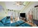 Bright living room with a soaring ceiling, wood flooring, and comfortable seating at 14002 N 49Th Ave # 1094, Glendale, AZ 85306