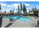 Inviting community pool with clear blue water, chairs, and landscaped surroundings at 14002 N 49Th Ave # 1094, Glendale, AZ 85306