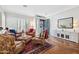 Inviting living room with hardwood floors, plantation shutters, and elegant decor at 1427 E Palomino Dr, Gilbert, AZ 85296