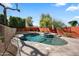 Backyard pool area featuring a heated pool, spa and fenced yard at 1427 E Palomino Dr, Gilbert, AZ 85296