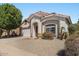 Beautiful single-story home featuring low maintenance landscaping with a two car garage at 15822 W Boca Raton Rd, Surprise, AZ 85379