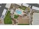 Aerial view of a neighborhood pool featuring lounge seating, landscaping, and parking nearby at 16013 S Desert Foothills Pkwy # 2120, Phoenix, AZ 85048