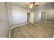 This bedroom features light flooring, a closet with mirrored doors, and neutral walls at 16013 S Desert Foothills Pkwy # 2120, Phoenix, AZ 85048