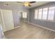 Bright bedroom with mirrored closet doors, ceiling fan, and plantation shutters at 16013 S Desert Foothills Pkwy # 2120, Phoenix, AZ 85048