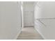 Walk-in closet featuring white walls and shelves with wood-look floors, providing ample storage space at 16013 S Desert Foothills Pkwy # 2120, Phoenix, AZ 85048