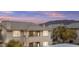 Beautiful multi-story condo with a tiled roof and desert landscaping, offering a serene living environment at 16013 S Desert Foothills Pkwy # 2120, Phoenix, AZ 85048