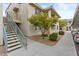 Exterior view of condos with inviting walkways, desert landscaping, and ample parking, perfect for residents at 16013 S Desert Foothills Pkwy # 2120, Phoenix, AZ 85048