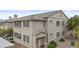 Two-story condo featuring neutral stucco, a balcony, and tasteful landscaping at 16013 S Desert Foothills Pkwy # 2120, Phoenix, AZ 85048