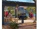 Outdoor grilling area features a stone picnic table, grill, and beautiful water view at 16013 S Desert Foothills Pkwy # 2120, Phoenix, AZ 85048