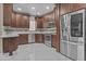 Modern kitchen with stainless steel appliances, custom backsplash, and ample storage in the cabinetry at 16013 S Desert Foothills Pkwy # 2120, Phoenix, AZ 85048