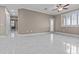 Bright, open living room featuring tile floors, fresh paint, and a modern ceiling fan at 16013 S Desert Foothills Pkwy # 2120, Phoenix, AZ 85048