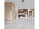 Open floor plan of living room with a kitchen boasting stainless steel appliances and tile flooring at 16013 S Desert Foothills Pkwy # 2120, Phoenix, AZ 85048