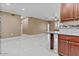 Open-concept living space with a granite counter top and tiled floors connecting kitchen and dining areas for entertaining at 16013 S Desert Foothills Pkwy # 2120, Phoenix, AZ 85048