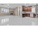 Bright living space with tiled floors, cozy fireplace, and a modern kitchen, creating a welcoming atmosphere at 16013 S Desert Foothills Pkwy # 2120, Phoenix, AZ 85048