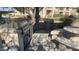 Community BBQ area features a built-in grill, stone counters, and comfortable seating for outdoor gatherings at 16013 S Desert Foothills Pkwy # 2120, Phoenix, AZ 85048