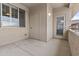 Outdoor patio with neutral walls, a storage closet and a sliding glass door with natural light at 16013 S Desert Foothills Pkwy # 2120, Phoenix, AZ 85048